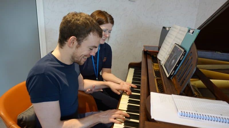 a client with a neurological condition has a music therapy session at STEPS