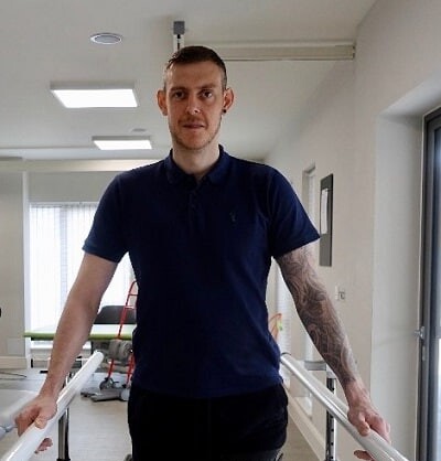 Shaun, our client with a spinal cord injury in the gym at STEPS